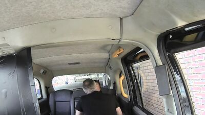 Slutty woman is blowing a cab driver and getting banged in a Fake Taxi episode