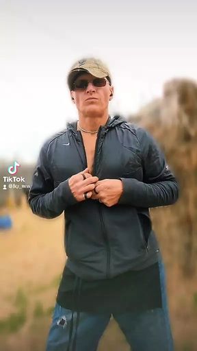 Just a guy undressing