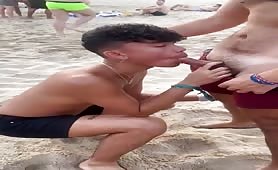 Getting my dick sucked in front of everyone in the beach