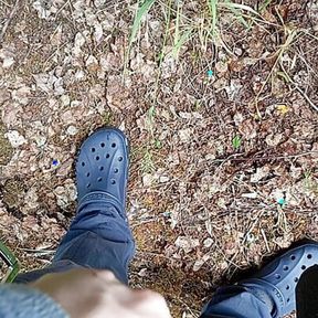 Boy pissing in the forest