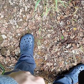 Boy pissing in the forest