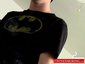 Inked skinny dude plays with himself while smoking