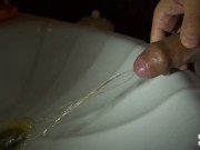 Dick pissing in the sink, slow motion 100fps
