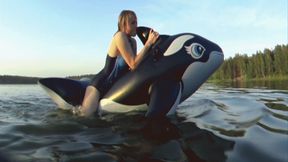 Alla is a hot rider on a black inflatable whale on the lake!!!