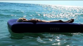 I Watched on the Beach How a Naked Girl with Big Tits Was Sunbathing on a Mattress. Slow Motion