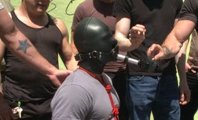 Insolent men treat male slave with perversions in merciless gangbang in public