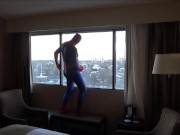spider shoots onto hotel window