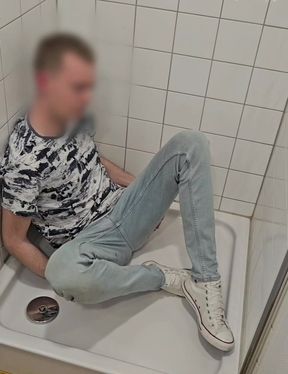 Playing in shower fully clothed in jeans and chucks