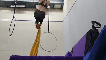 Practicing hip locks on the aerial silks