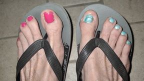 Night dangling with flip flops and painted toenails