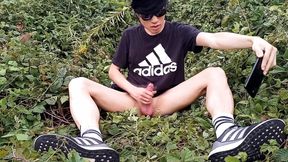 Jon Arteen, a gay Asian twink, is dressed in an Adidas t-shirt, hot pants, white socks, and Duramo sneakers. He jerks off