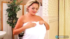 Busty blonde model frolics in the tub