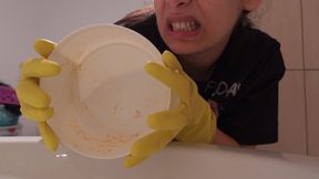 My Indian stepsister doesn't like washing dishes but someone has to do it so she washes the dishes in a yellow dishwashing glove