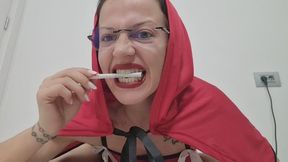 Crystal licks the cigarette and smokes it with her red lips.