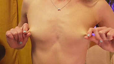 The girl plays with her nipples