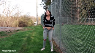Long Haired Brunette Pisses On The Side Of The Road