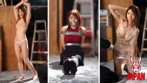Layer by layer, Mirei Ohtani is shaped, wrapped, and hidden—kneeling obediently on the floor in the Tool Room, even as her world vanishes under tape bondage