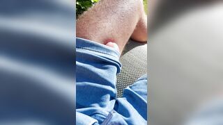 Rubbin' huge penis erection thru trousers in the garden