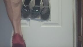 Tempest is playing peek a boo in stripped dress with red heels