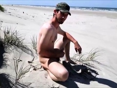 Exhibtionist jerking at the beach