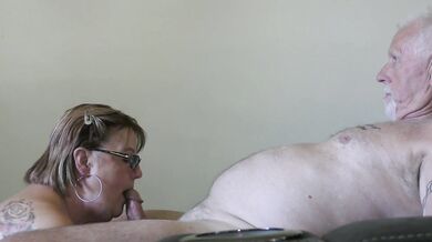 Tattooed milf sucks her Master's cock then takes it hard grinning at the camera