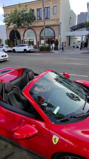 Red Ferrari convertible top down