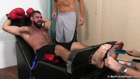 Hunk boxer Ricky Larkin is tied up by Sergey and his friend