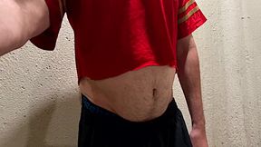 Athlete shows his ball gut and navel