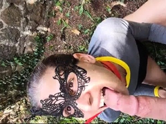 Masked teen on a leash worships a POV cock in the outdoors