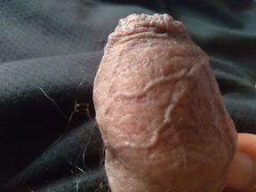 young man takes his thick penis in his hand