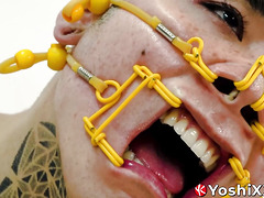 Submissive Yoshi Kawasaki moans while being bound and gagged