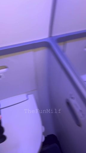 Busty pregnant woman plays with a dildo on an airplane