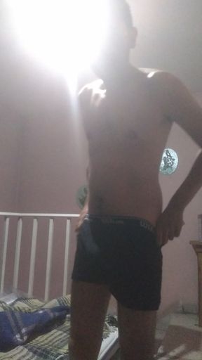 Young man strips naked