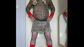 gay crossdresser enjoying the taste of his two glasses of pee that has just come out of his cock