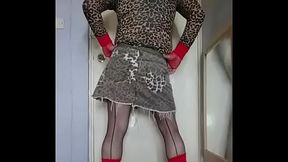 gay crossdresser enjoying the taste of his two glasses of pee that has just come out of his cock