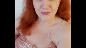 Sexy redhead babe shows off her big tits on webcam