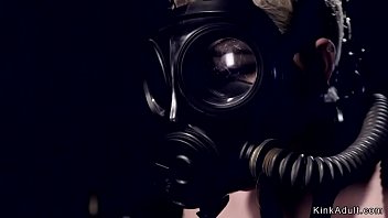 Blonde slave with gas mask tormented