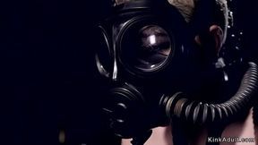 Blonde slave with gas mask tormented