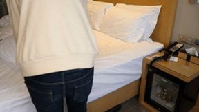 GG26 - A barefoot girl is bound by ropes and wrapped in a blanket.