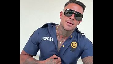 A man in police officer cosplay jerks off