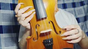 Long natural nails and violin