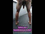 Hairy colombian sits on his heels and strokes his penis