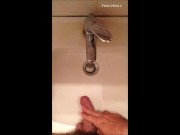 Peeing into wash basin in  restroom