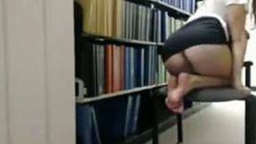 Cute and spoiled chick flashing her privates in a library