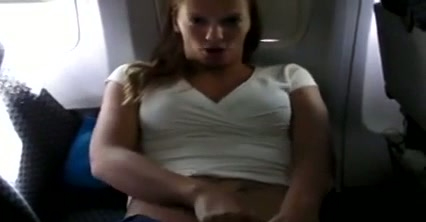 Lovely and horny blonde chick on the plane flashing and masturbating