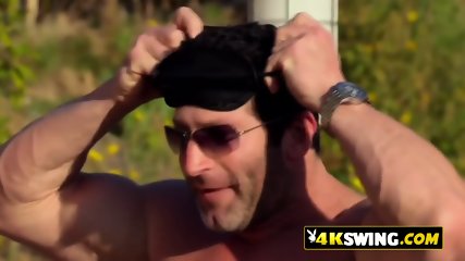 Redheads and bodybuilders are what swingers like to fuck at the red room in a big interracial orgy.