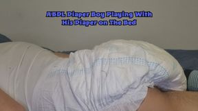 ABDL Diaper Boy Playing With His Diaper on The Bed