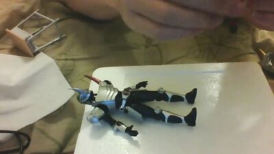 Amateur Japanese bloke is playing with his toys in front of the cam