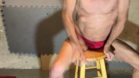 in basement on stool in color changing underwear briefs