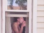 Neighbor Twink using dildo on ass and mouth in window